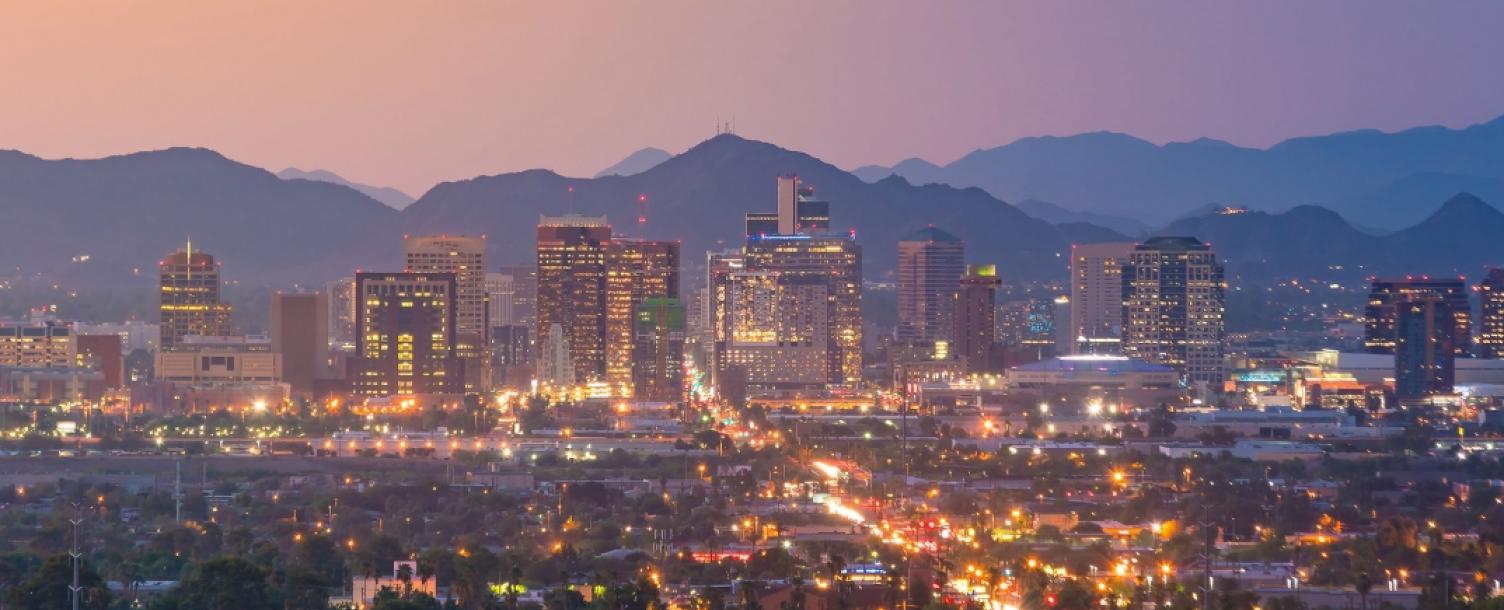 Downtown Phoenix at night with the city lights on